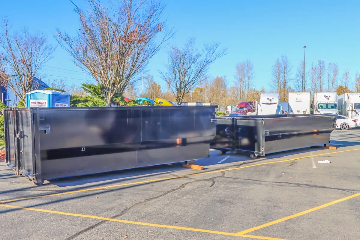 Professional dumpster rental service with roll-off container on residential driveway in Fox Chapel